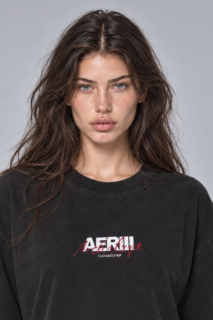 ARCHETYPE tee in black, waist-up, front, on a female model