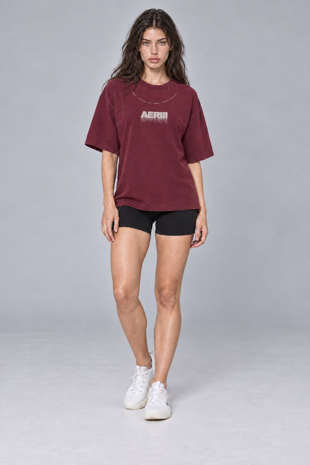 DISSOLVE tee in burgundy, front, full length, on a female model