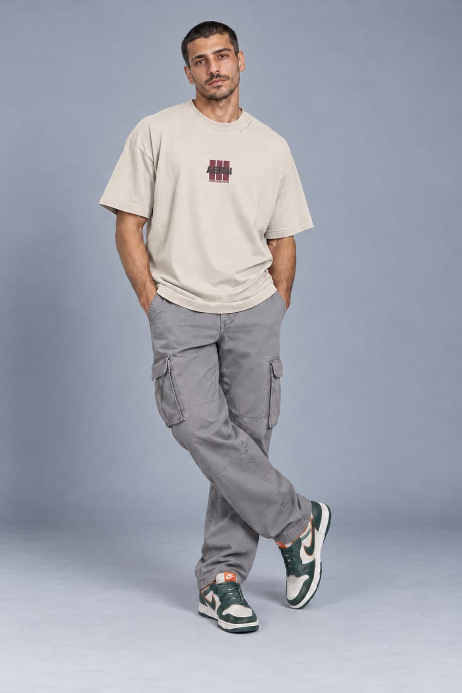 LIMITLESS CLUB MOON tee in moon mist, posed, full length, on a male model